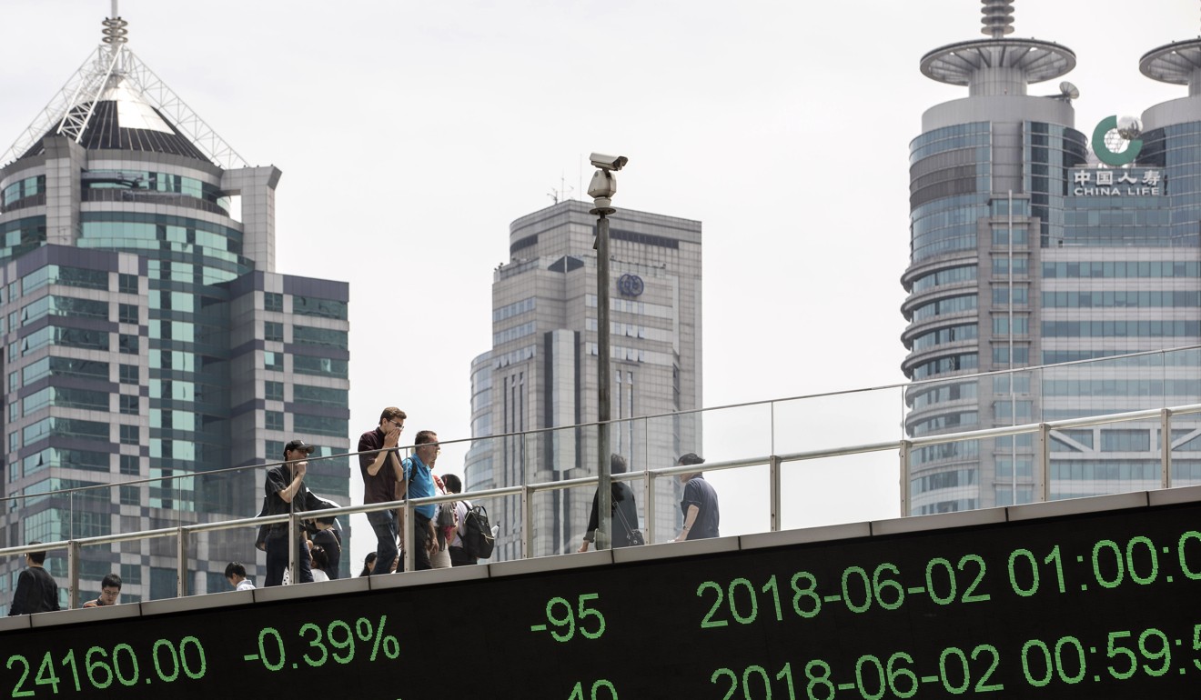 An electronic ticker displays stock figures in Pudong's Lujiazui Financial District in Shanghai. Photo: Bloomberg