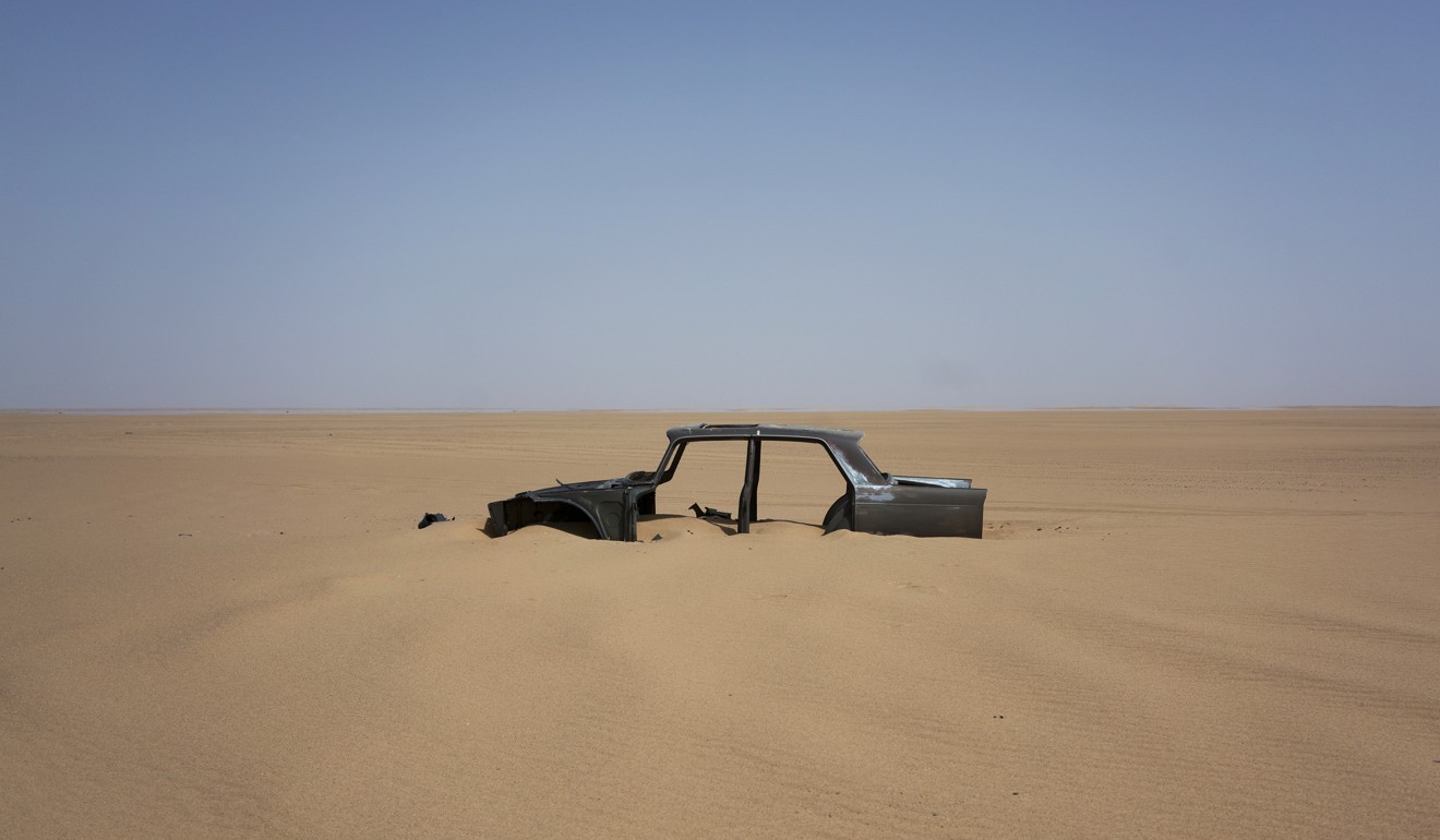 The frame of an abandoned Peugeot car rests in Niger's Tenere desert region of the south central Sahara on Sunday, June 3, 2018. Photo: AP
