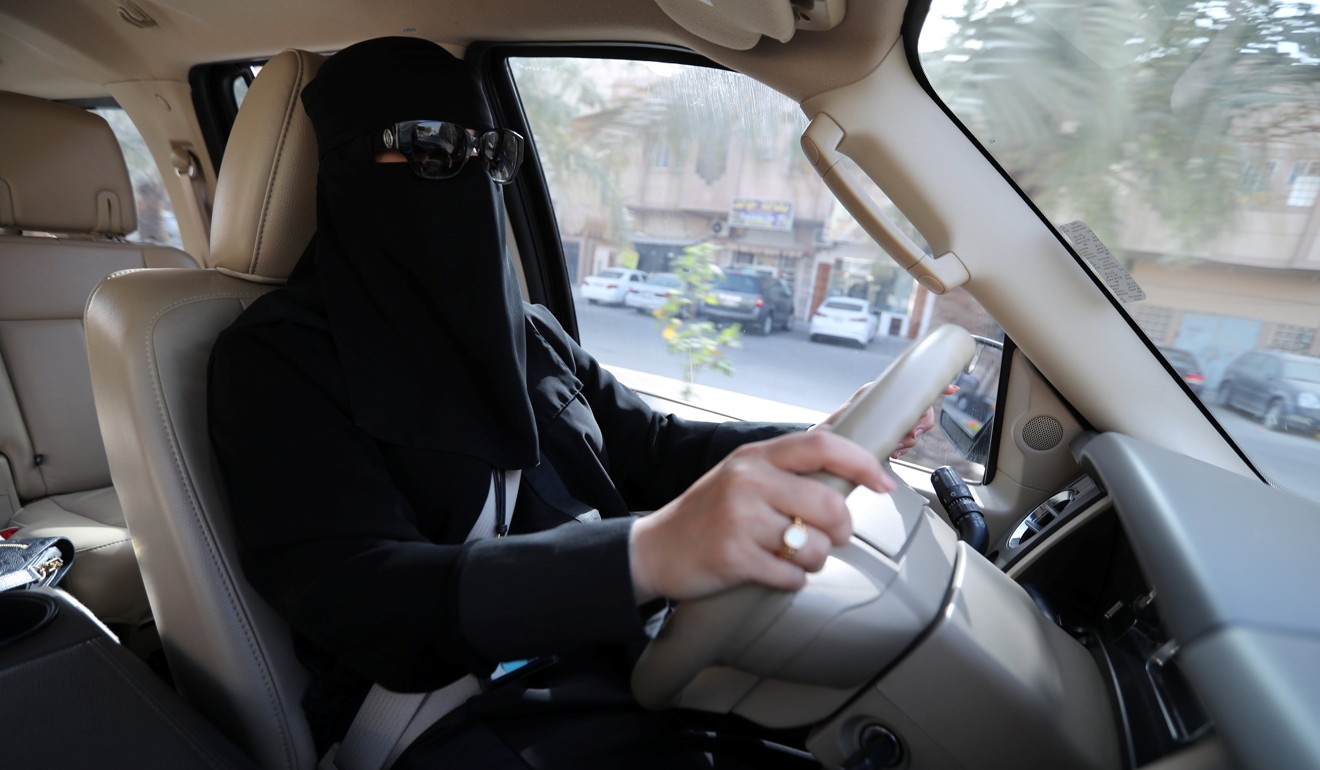A Saudi woman who works at energy company Aramco drives to her office in Dammam on Sunday. Photo: Reuters