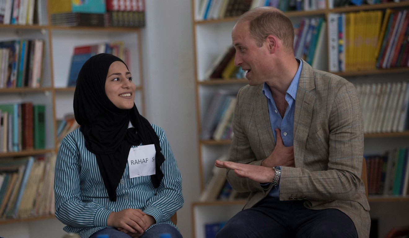 Prince William with one of several Palestinian students he spoke with inside a United Nations-run school at the Jalazone refugee camp near Ramallah, in the occupied West Bank. Photo: Reuters