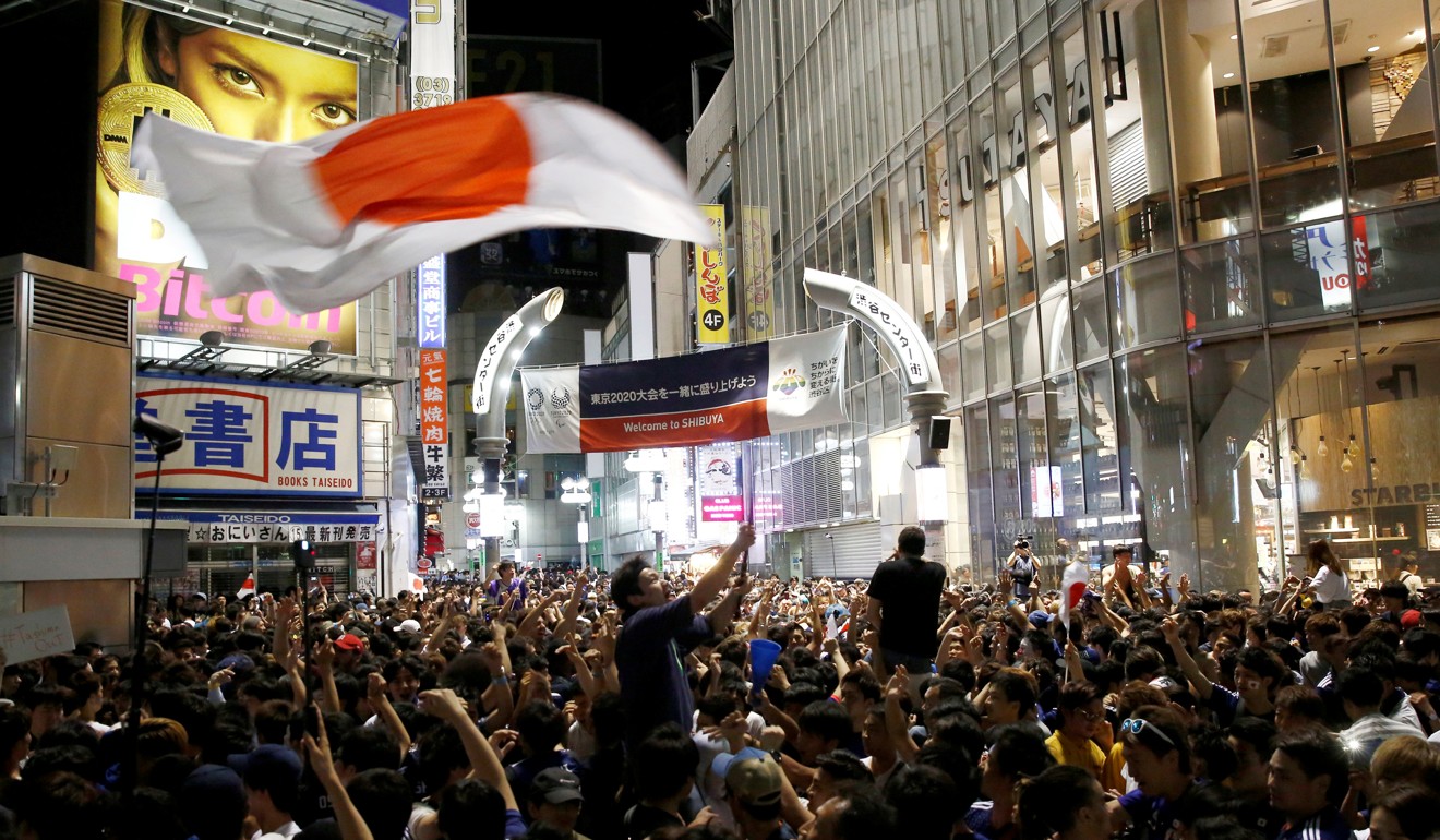 Japanese fans pouring onto the street after the World Cup Group H match between Japan and Poland. Photo: Reuters
