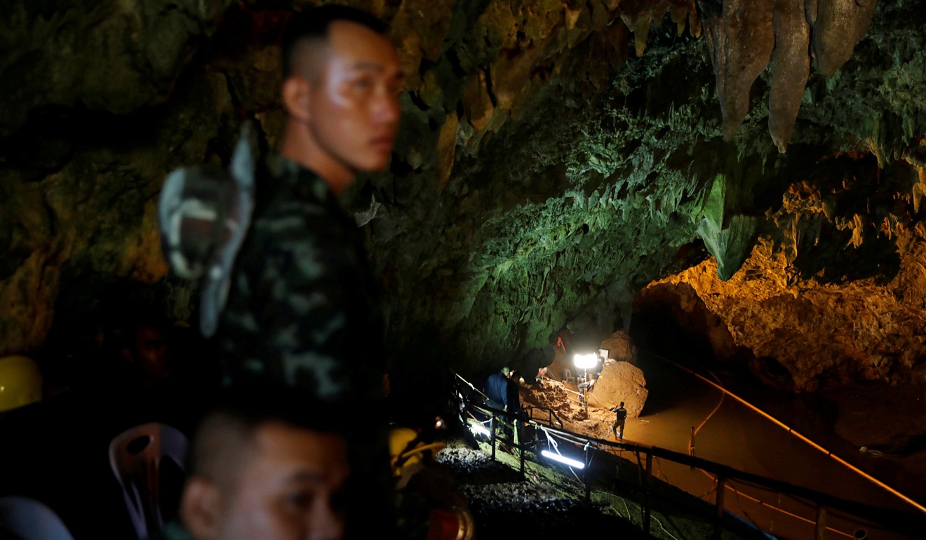 Soldiers and rescue workers near the Tham Luang cave complex. Photo: Reuters