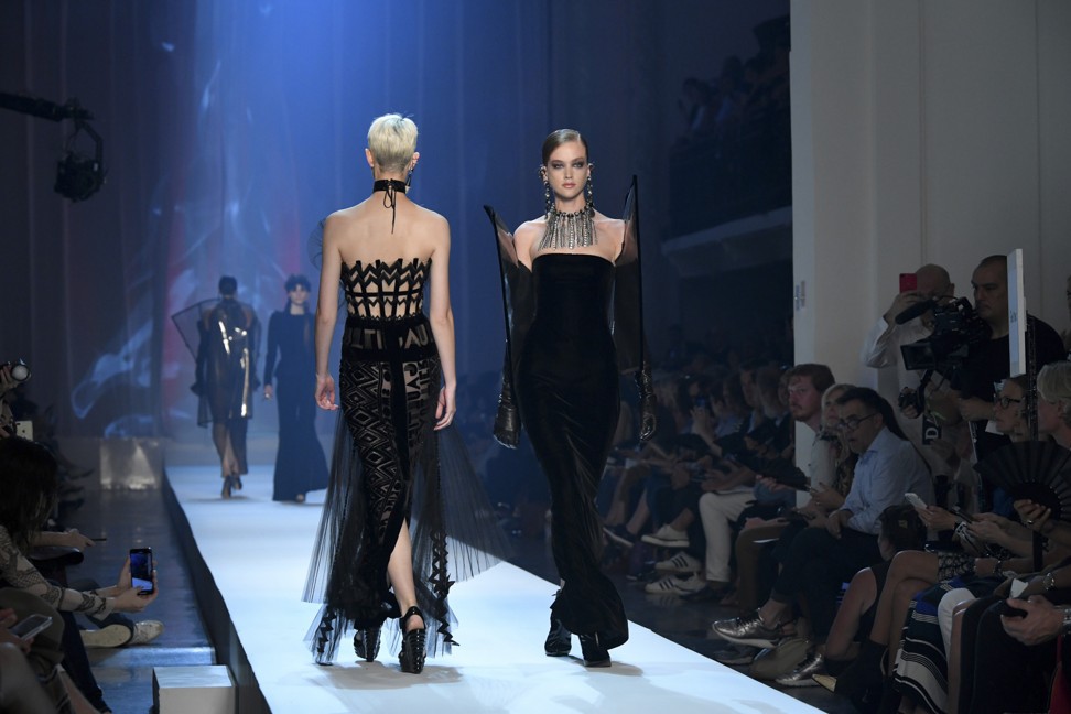 Chic black dresses by Jean-Paul Gaultier on the runway. Photo: Xinhua