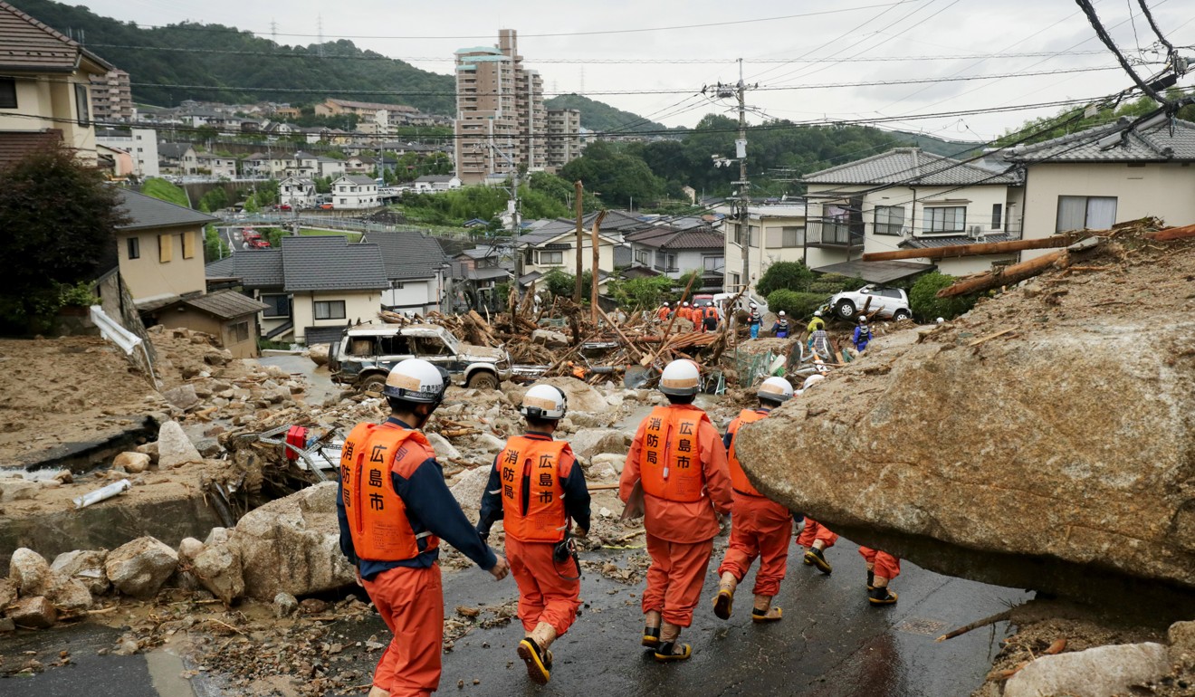 Rescuers searching for missing people in an area of Hiroshima that was hit by a landslide. Photo: EPA-EFE