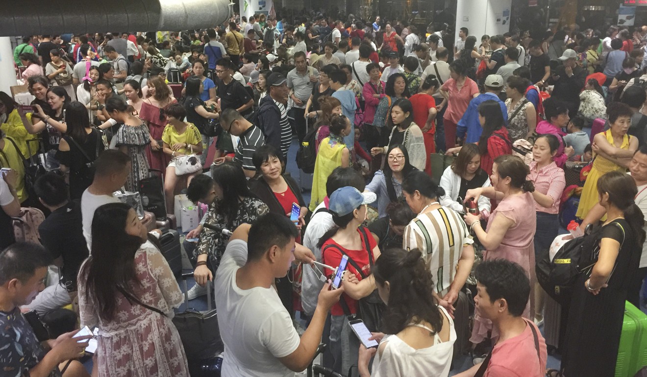The waiting area of the Hong Kong-Macau ferry terminal in Sheung Wan is packed with travellers on June 26. Photo: Simon Wang