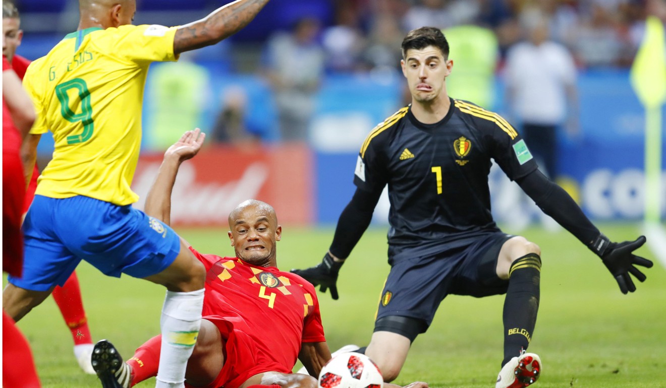 Belgium's goalkeeper Thibaut Courtois blocks a shot. Photo: Kyodo