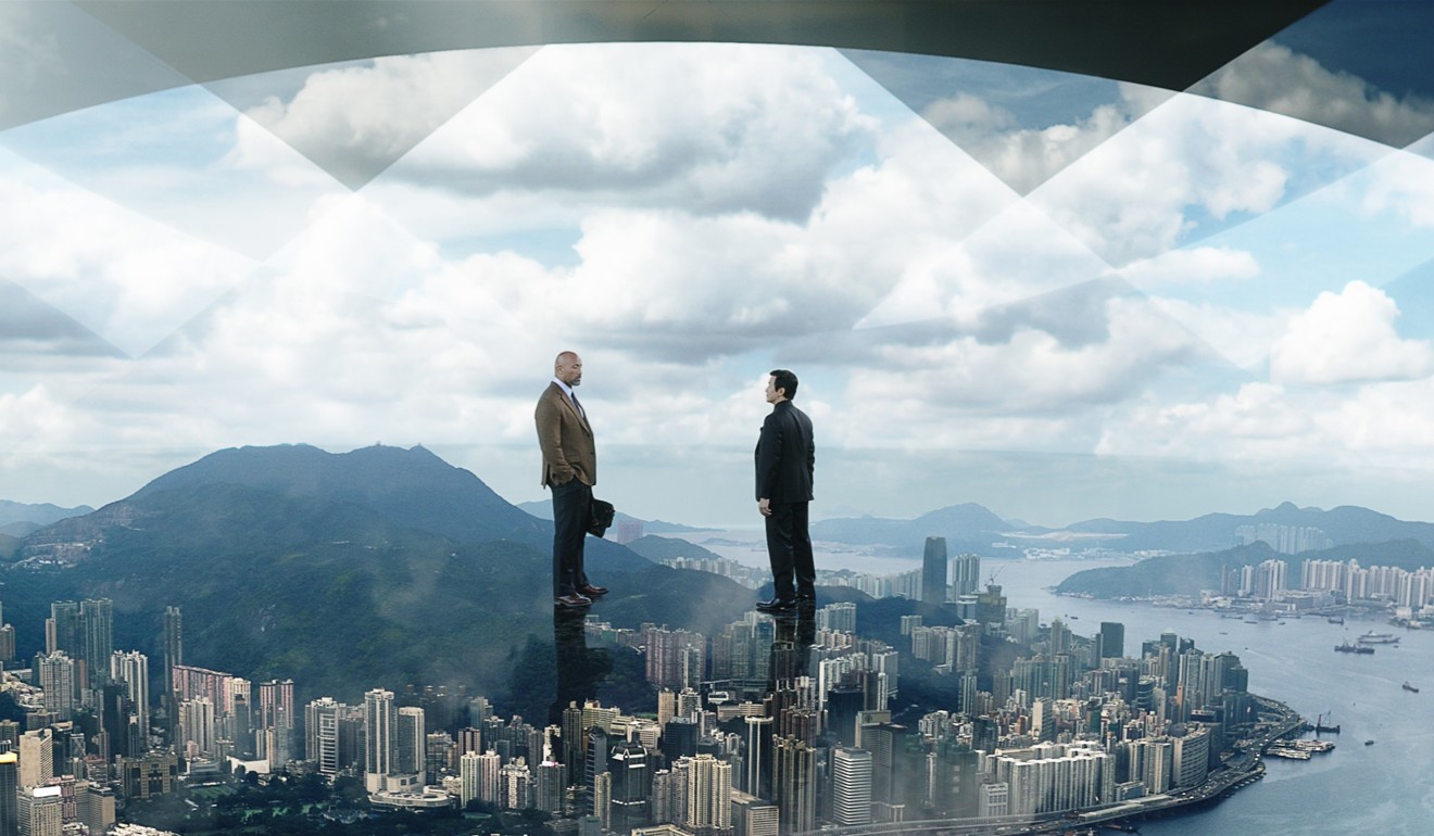 Dwayne Johnson and Chin Han in a still from Skyscraper.