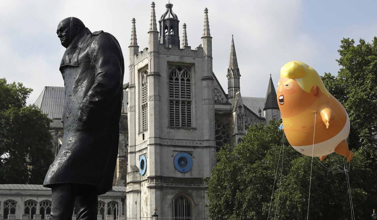 A ‘baby’ balloon hovers near the statue of Winston Churchill in London. Photo: AP