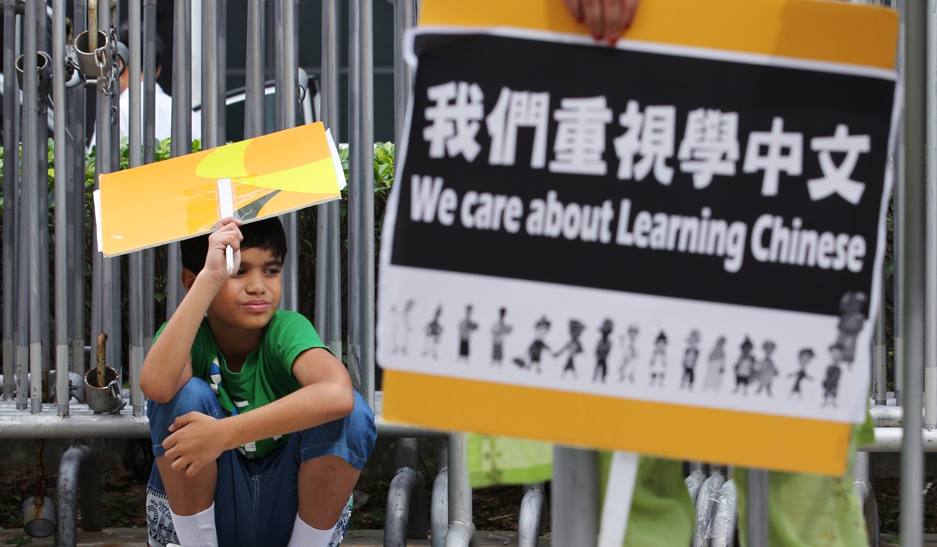 Ethnic minority groups demonstrate at the Hong Kong government headquarters in Admiralty, calling for an end to the “discriminatory” Chinese education policy, in August 2013. Photo: Nora Tam