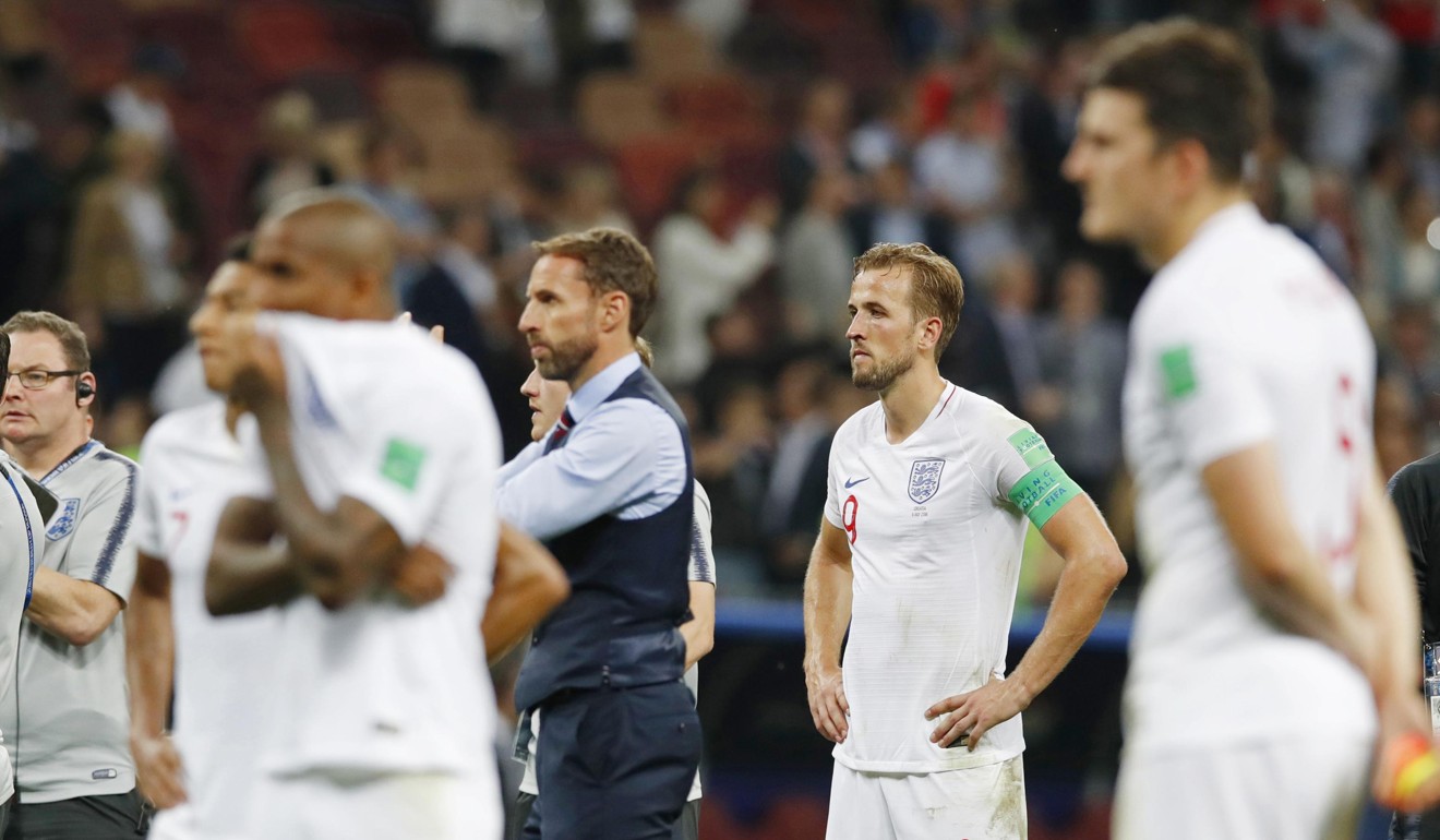 England coach Gareth Southgate and his players look dejected after losing to Croatia. Photo: Kyodo