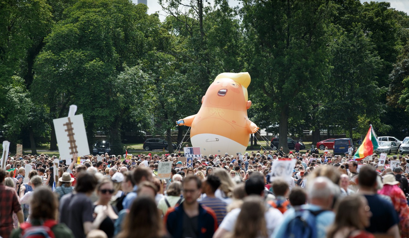 A giant balloon depicting US President Donald Trump as an orange baby is launched as protesters gather in Edinburgh. Photo: AFP