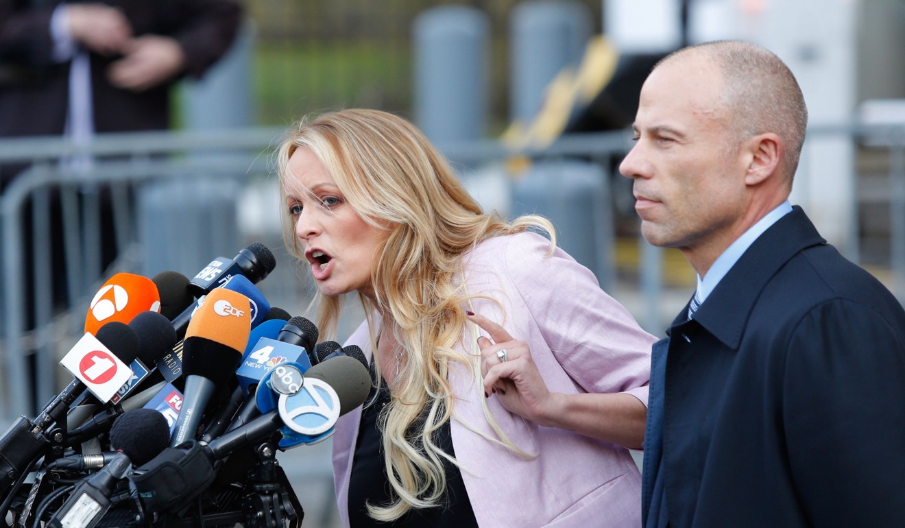 Porn star Stephanie Clifford, also known as Stormy Daniels, speaks outside US Federal Court with her lawyer Michael Avenatti in April. Daniels says she also had an affair with Trump. Photo: AFP