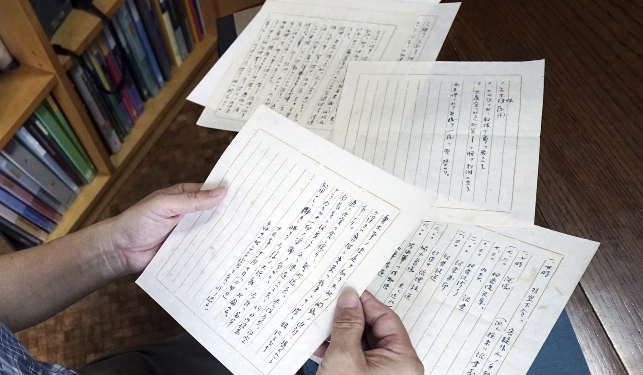 Takeo Hatano, a used bookstore owner, shows the five-page “Yuzawa memo”, written by Michio Yuzawa. Photo: AP