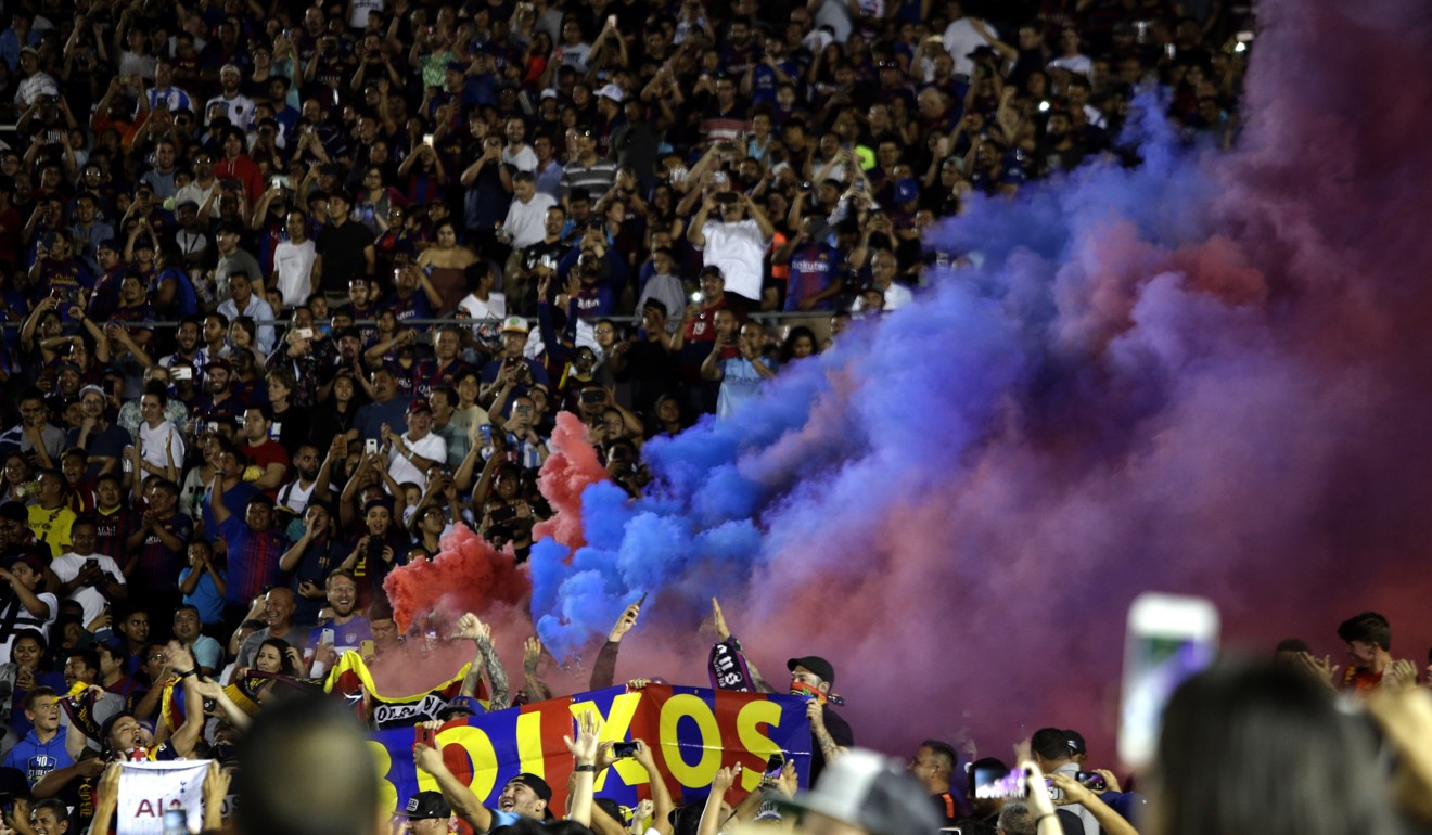 A smoke bomb is set off among the Barcelona fans during the International Champions Cup in Pasadena, California. Photo: EPA
