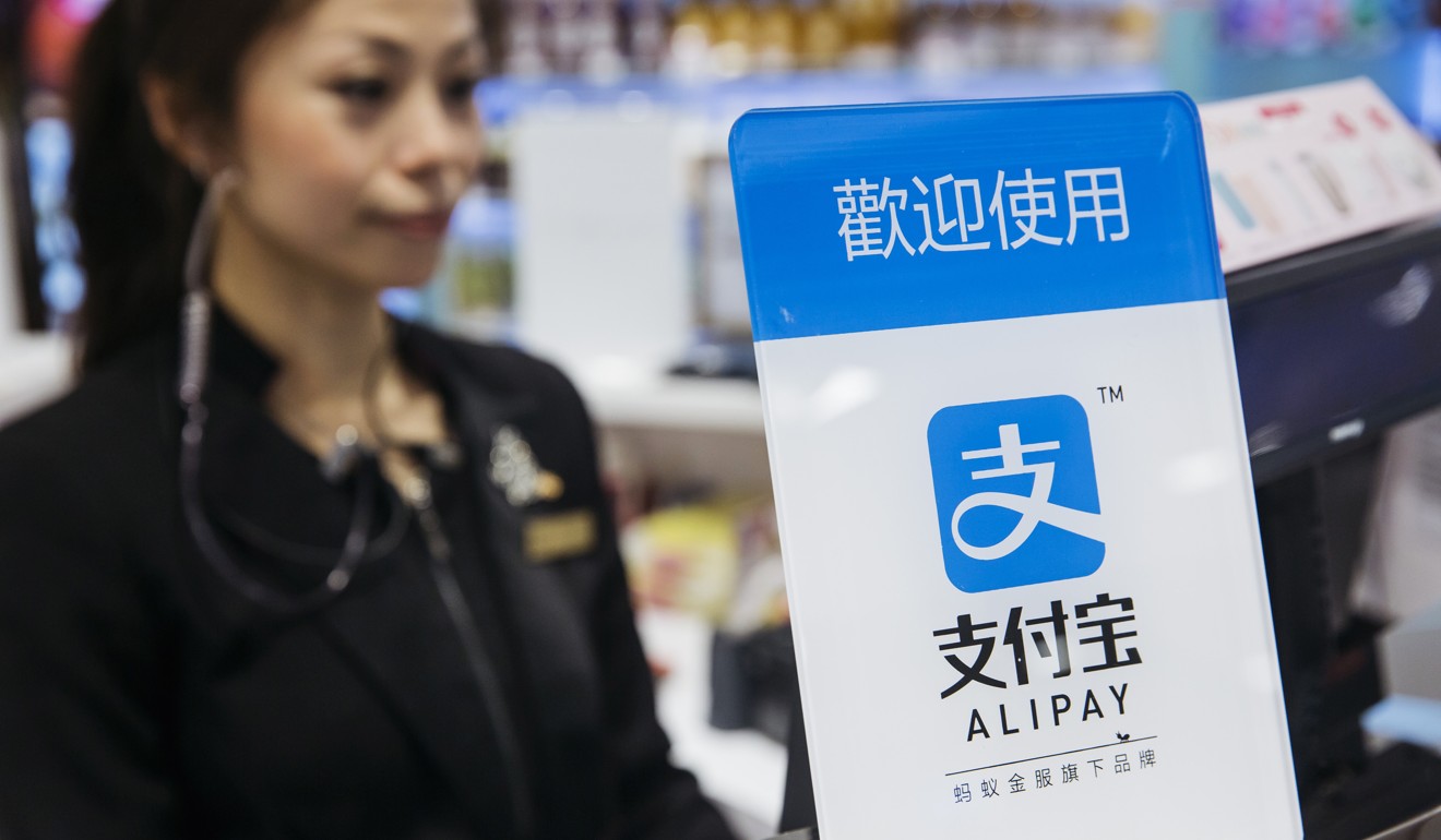Ant Financial’s Alipay, an affiliate of Alibaba Group Holding, is displayed at a cashier counter inside a Sa Sa International Holdings store in Hong Kong. Photo: Bloomberg