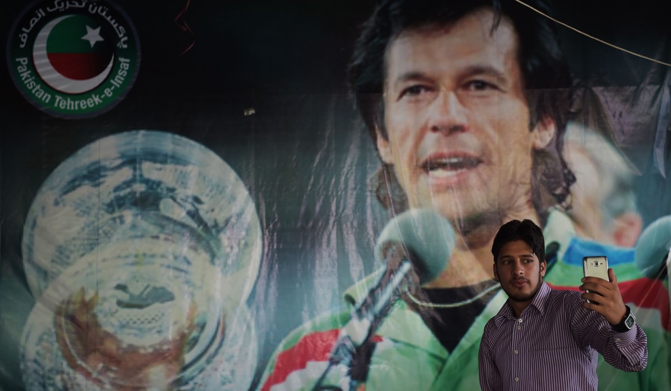 A poster of cricket hero turned politician Imran Khan, in Islamabad, Pakistan on July 30. Photo: AFP