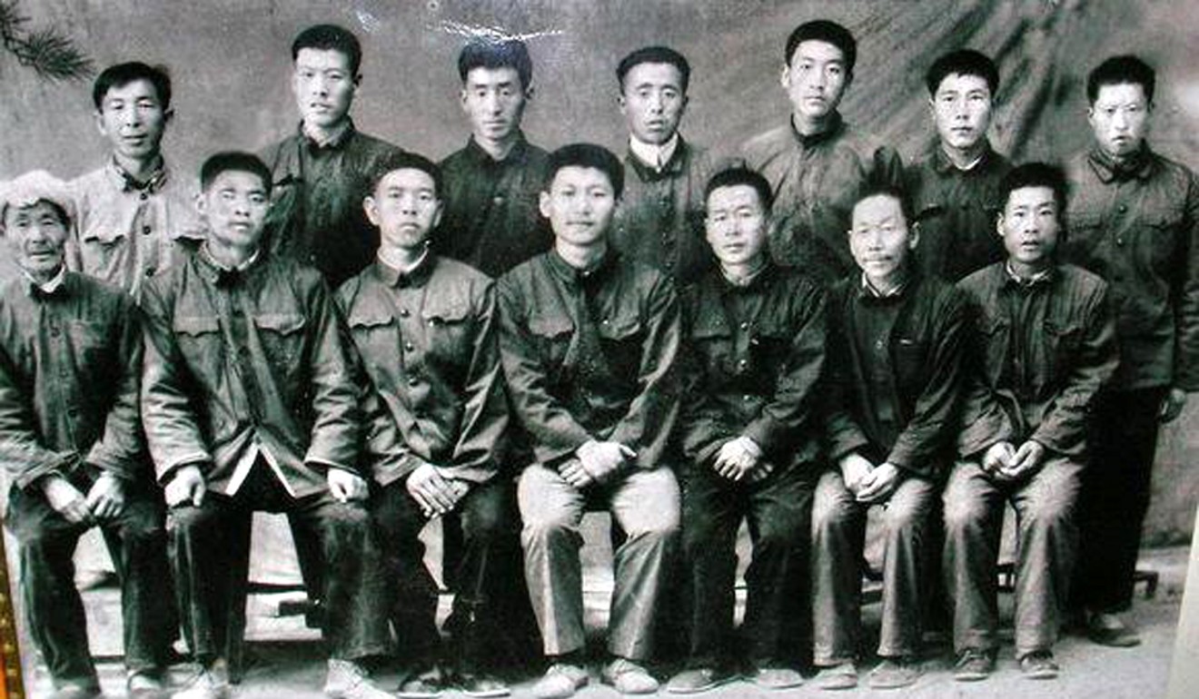 Xi Jinping (centre, front row) pictured with villagers before he left Liangjiahe. Photo: Handout