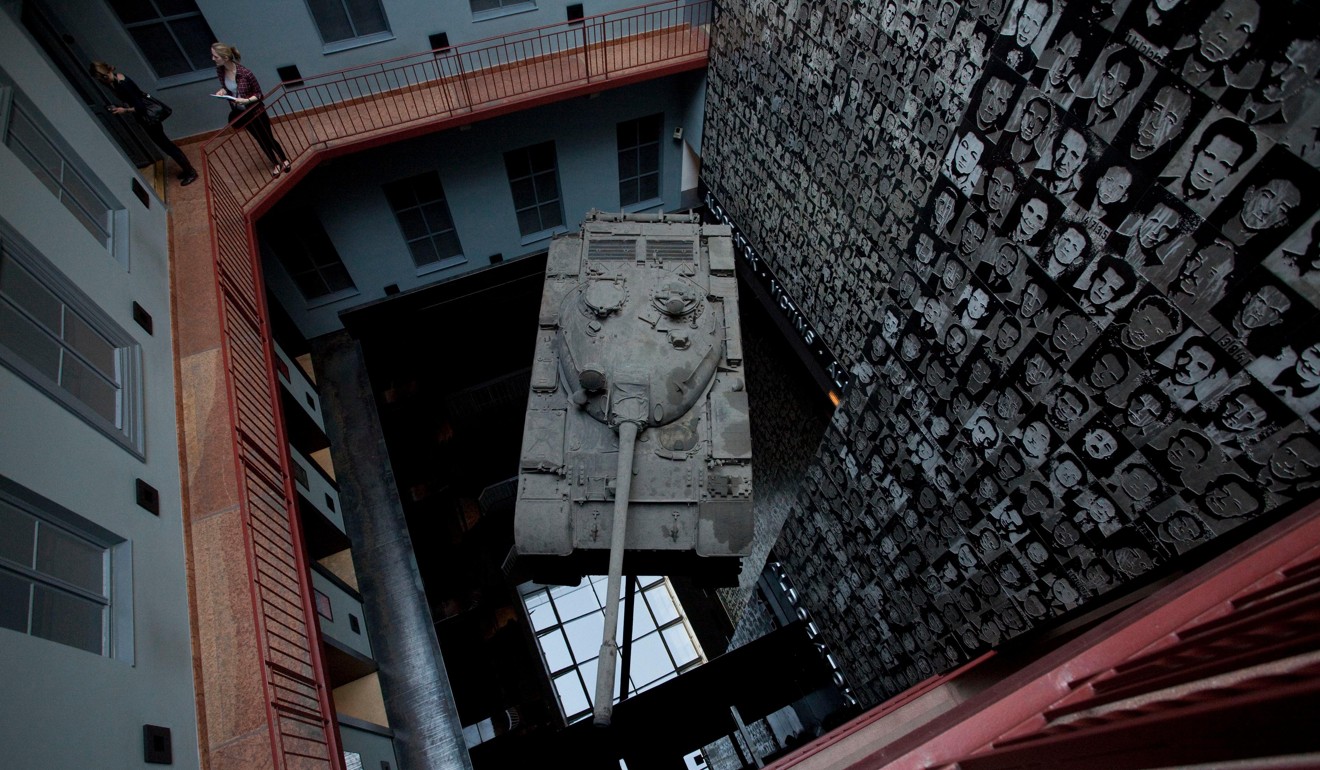 A Soviet tank in the central atrium of The House of Terror, in Budapest, Hungary. Picture: Alamy