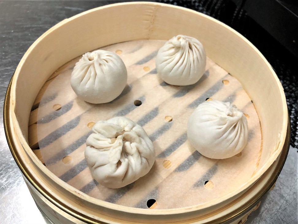 My failed xiaolongbao next to the chef’s beautiful ones.