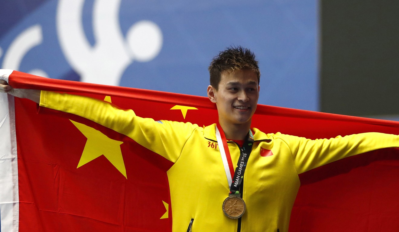 Sun Yang wears the yellow of 361 after winning the men’s 800m final. Photo: EPA