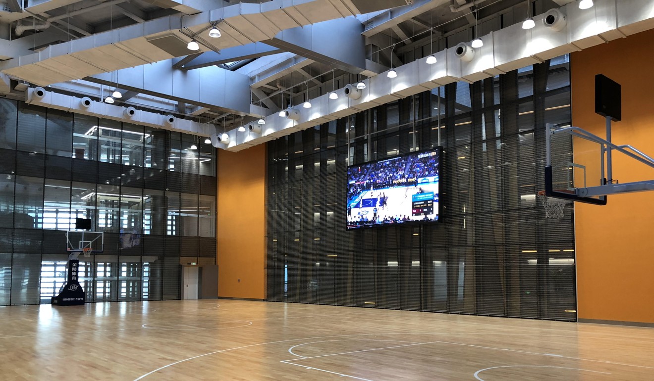 The full-size basketball court with giant screen at Tencent’s new headquarters in Shenzhen. Photo: SCMP/ Chua Kong Ho