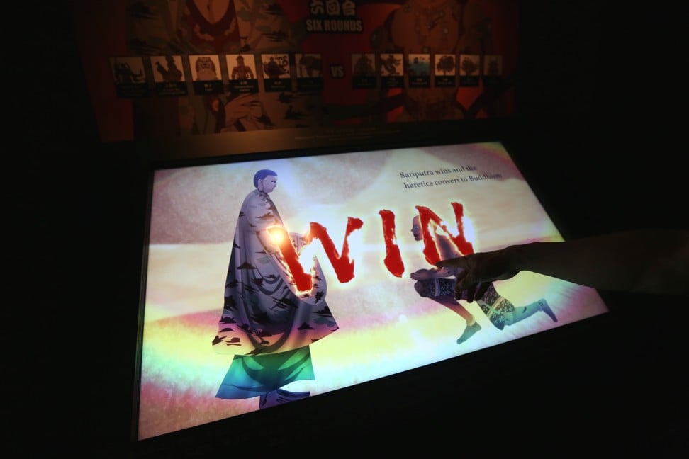 An interactive game that pits a Buddhist god against a demon in the exhibition. Photo: Xiaomei Chen