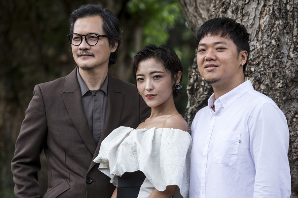 (From left) Singaporean actor Peter Yu, Chinese actress Luna Kwok and Singaporean director Siew Hua Yeo who worked on the film, 'A Land Imagined' about a migrant construction worker who disappears in Singapore. Photo: EPA-EFE