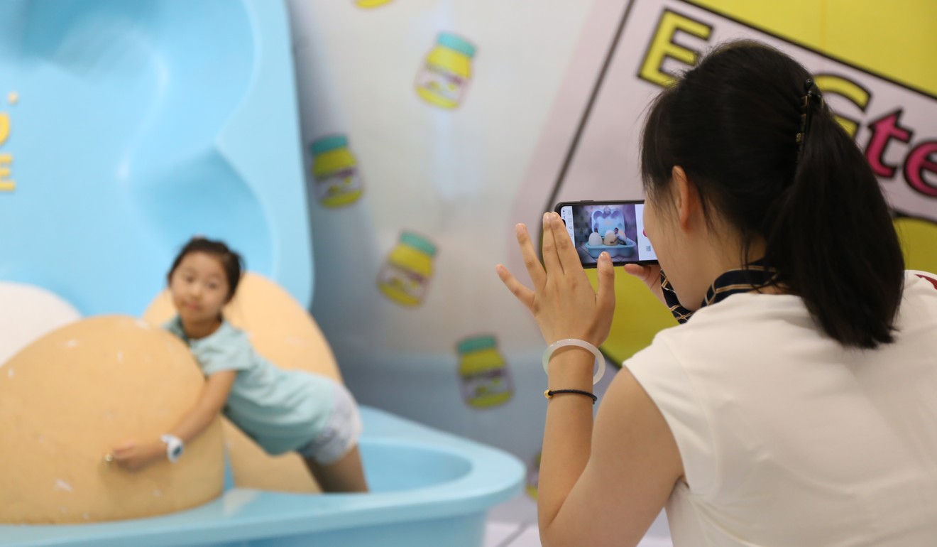 A visitor takes a photo at The Egg House in Shanghai. Photo: Rachel Cheung