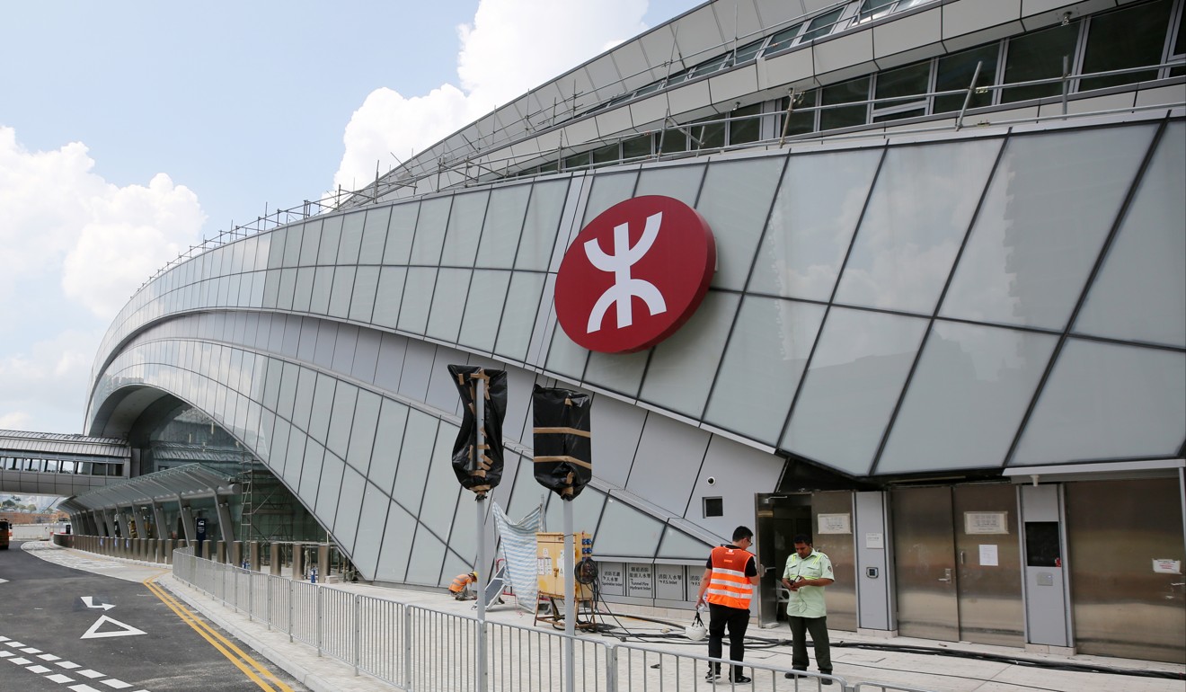 Workers on site at the Hong Kong West Kowloon railway station. Photo: Winson Wong