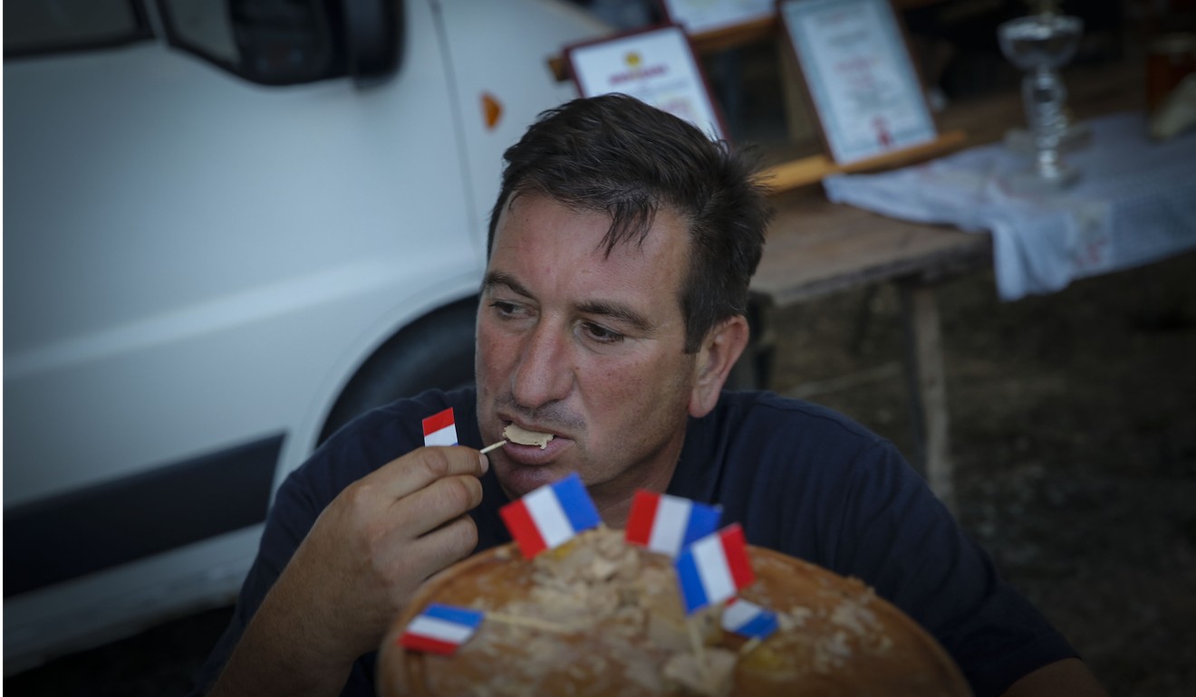 A participant tasting a dish. Photo: AFP