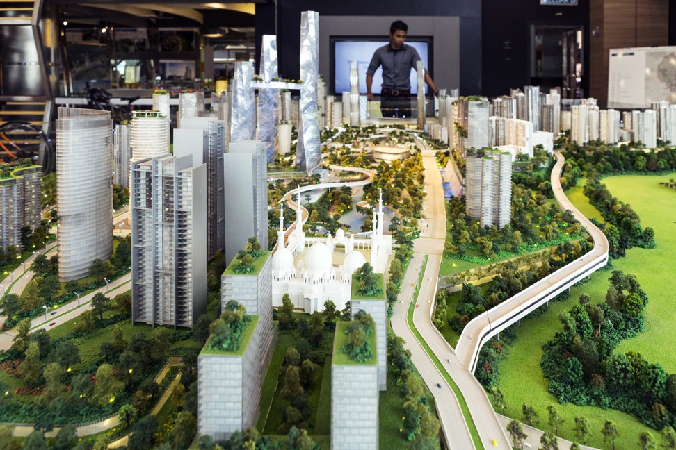 A model of the proposed Bandar Malaysia development, which Iskandar Waterfront Holdings Sdn. and China Railway Engineering Corp. bought 60 per cent of in December last year for 7.41 billion ringgit, in a showroom in Kuala Lumpur on October 7, 2016. The development will host terminals for a planned high-speed rail line connecting Kuala Lumpur to Singapore and has an estimated sales value of 150 billion ringgit. Photo: Bloomberg