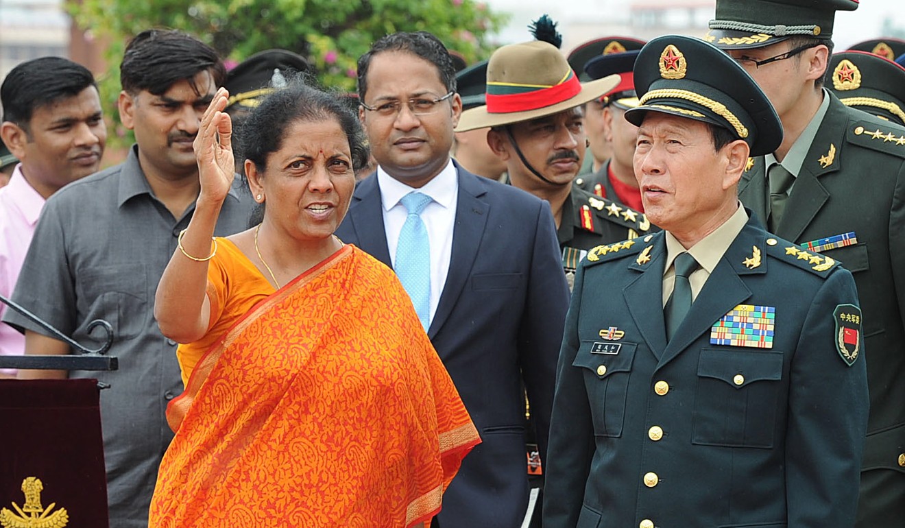 Indian Defence Minister Nirmala Sitharaman with Chinese Defence Minister Wei Fenghe. Photo: EPA