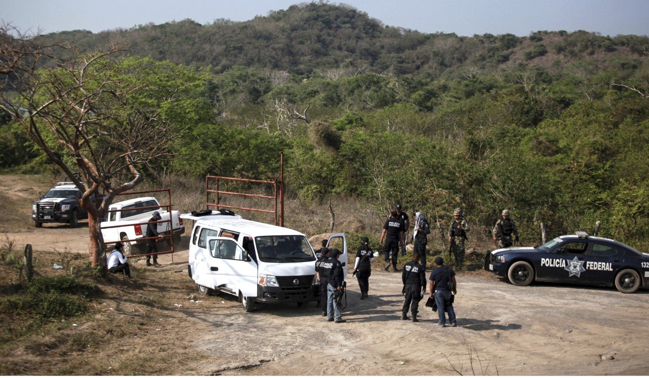 In this April 11, 2015, file photo, federal and state police, and expert investigators enter an area known as Colinas de Santa Fe on the outskirts of Veracruz, Mexico, in search of a mass grave. Photo: AP