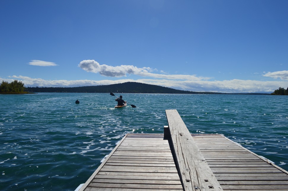 Kayakers enjoy a beautiful day on Green Lake in British Columbia. Photo: Andrew Machuk