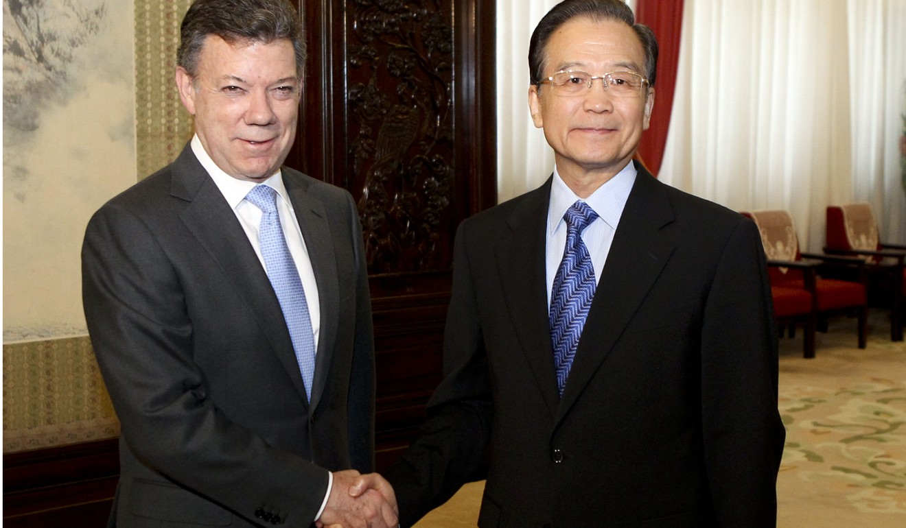 Premier at the time Wen Jiabao shakes hands with Colombian President Juan Manuel Santos in Beijing in May, 2012. Photo: Xinhua