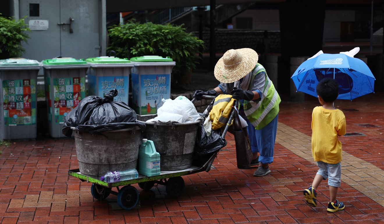 A 70-year-old street cleaner does her rounds in Tuen Mun. Photo: Nora Tam
