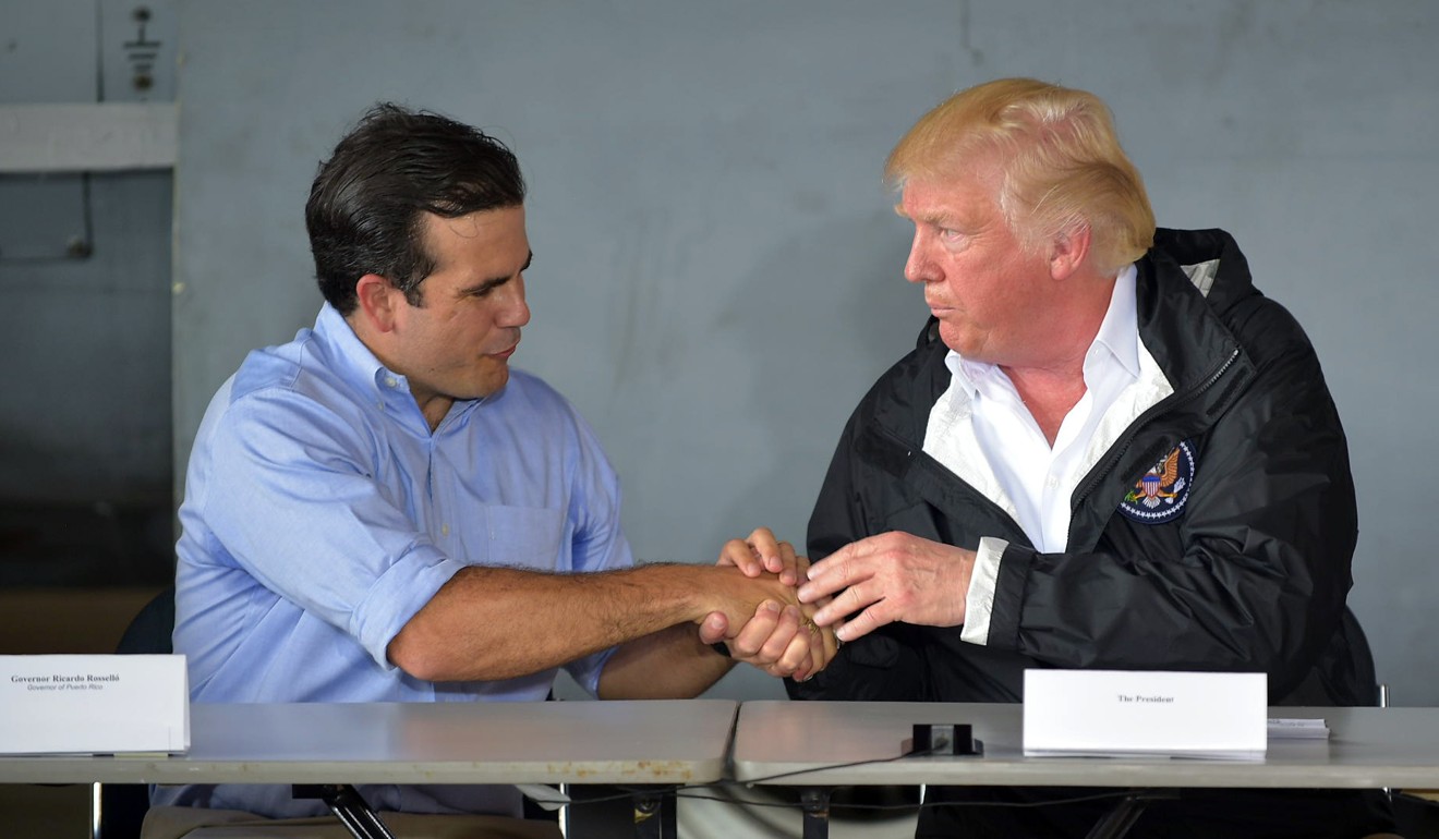 Trump with Puerto Rico’s governor, Ricardo Rossello, after the hurricane struck. Photo: AFP