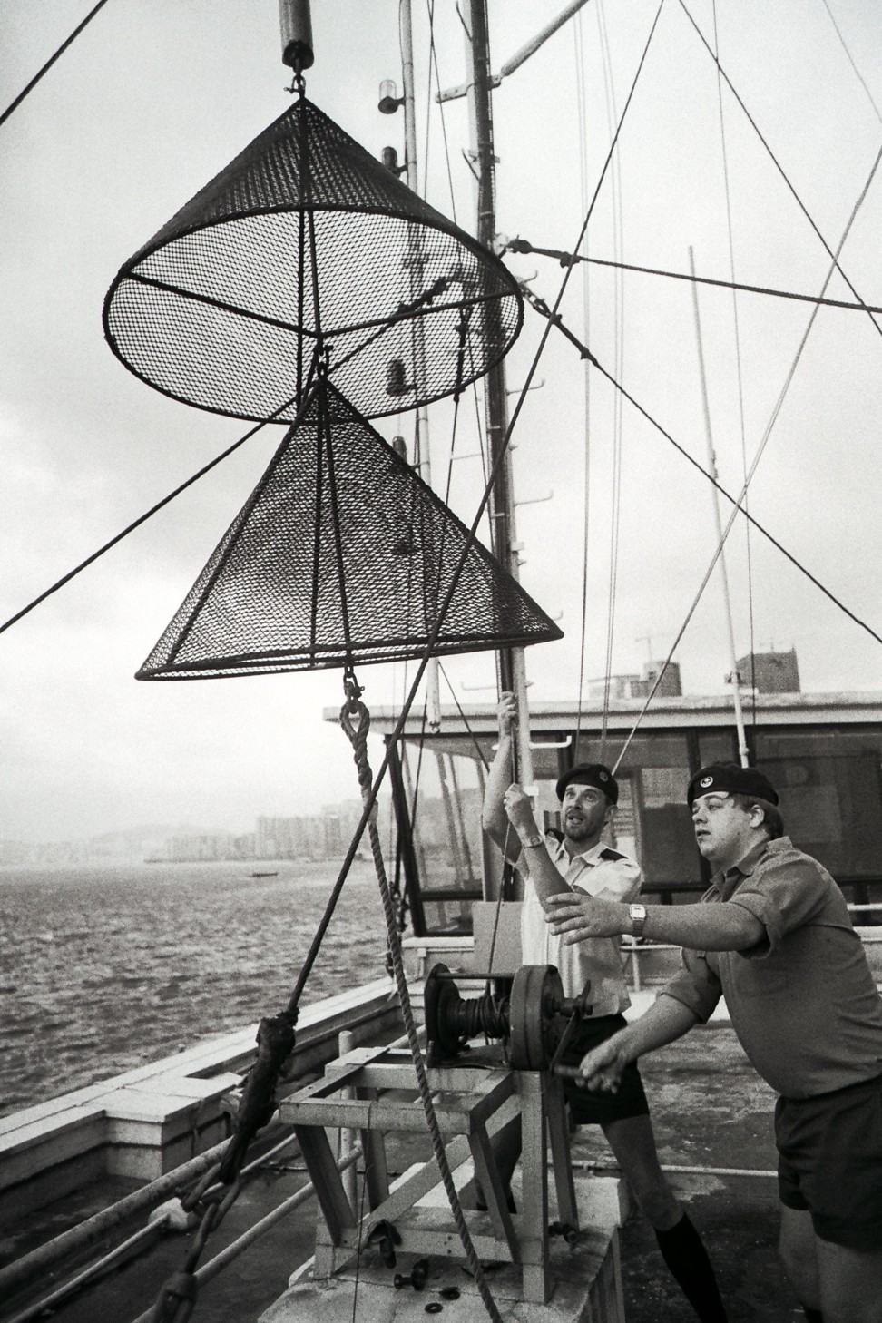 A typhoon signal No 8 is hoisted on the HMS Tamar.