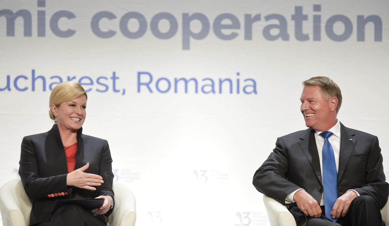 Croatian President Kolinda Grabar-Kitarovic, left, talks to Romanian counterpart Klaus Iohannis on Monday. Photo: AP