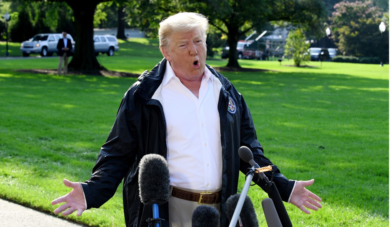 US President Donald Trump answers questions from reporters on the South Lawn before leaving the White House on September 19, 2018. Photo: TNS