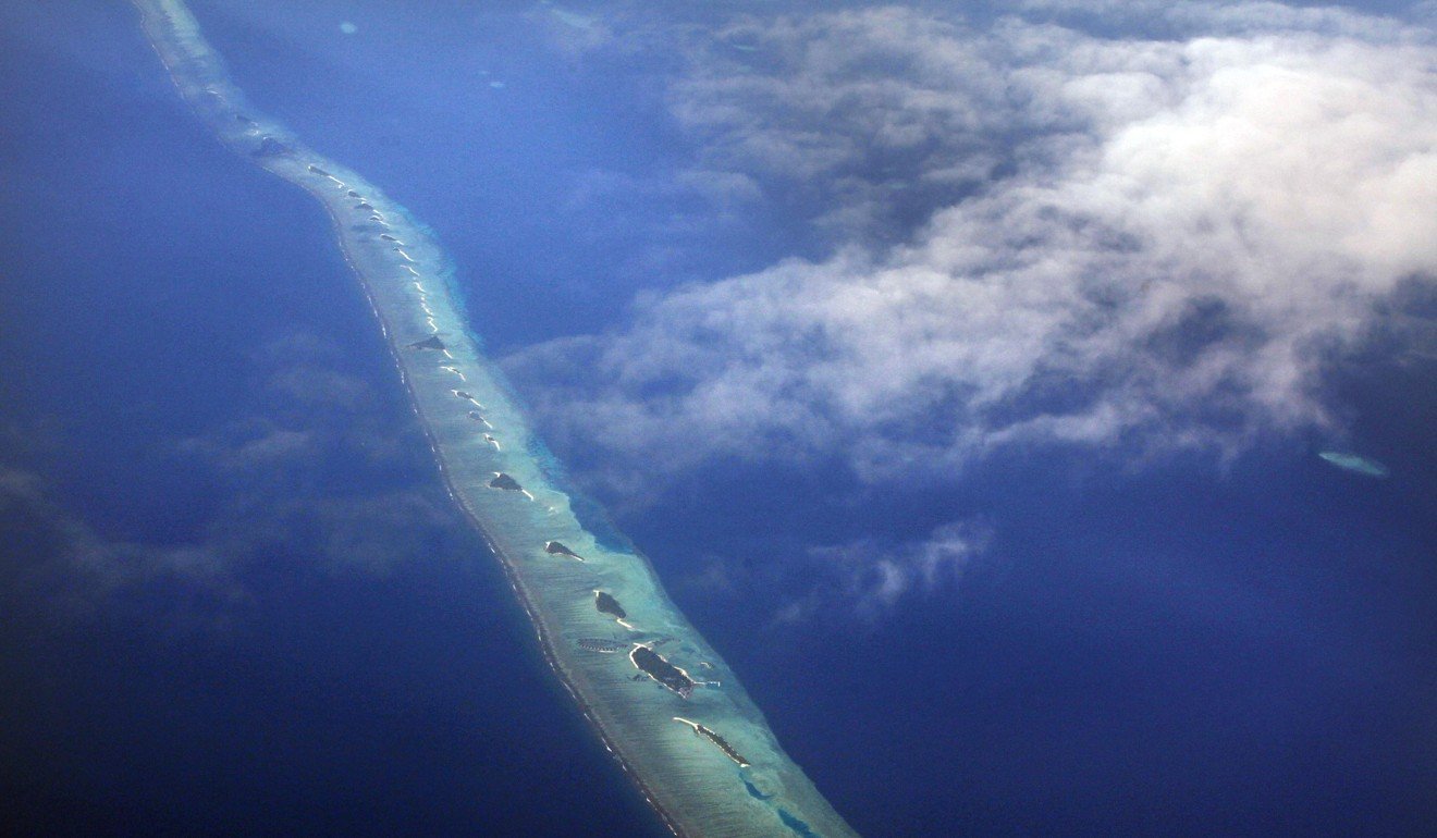An aerial view of an atoll in the Maldives, which faces dangers such as rising sea levels and more intense storms. Photo: Reuters