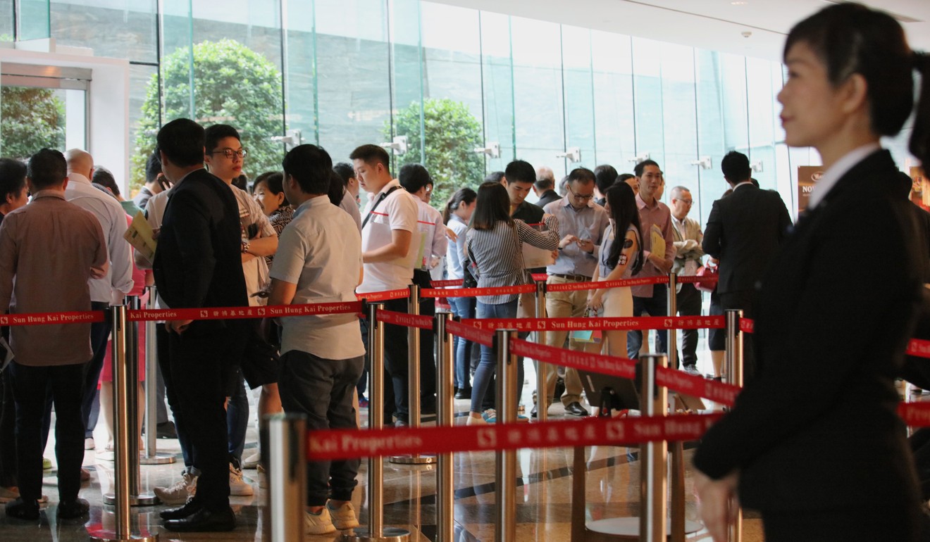 Potential buyers queue up to buy flats at the Cullinan West II put on sale by Sun Hung Kai Properties, at the International Commerce Centre in West Kowloon on September 2. The Estate Agents Authority has strengthened compliance checks at sales sites. Photo: Felix Wong