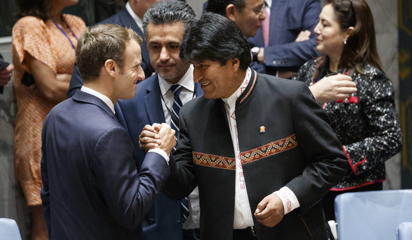 French President Emmanuel Macron greets Bolivian President Evo Morales during a United Nations Security Council briefing on Wednesday. Photo: AP