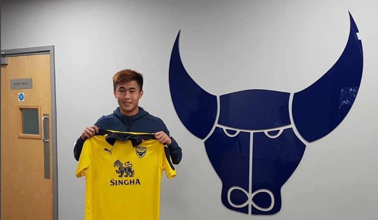 Tsun Dai poses with the shirt of new club Oxford United. Photo: Tsun Dai/Instagram