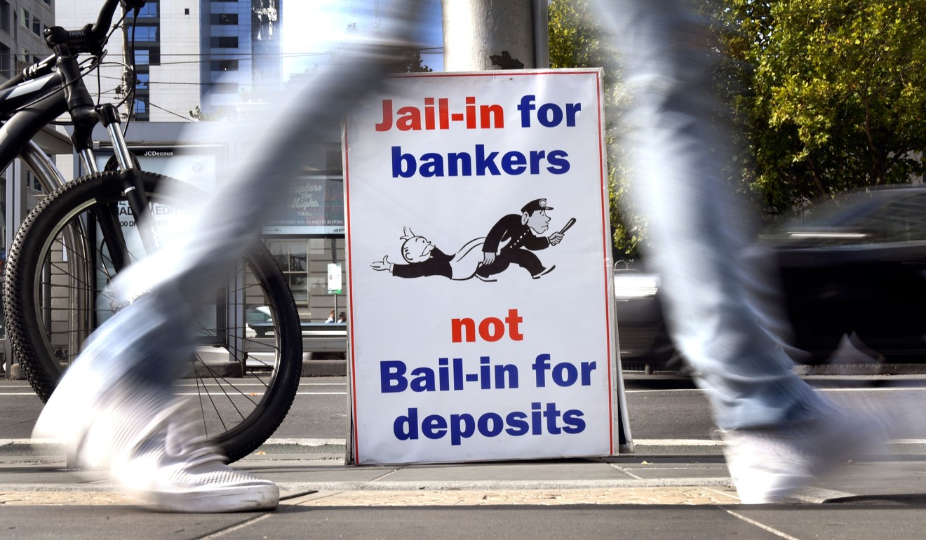 A placard outside the Banking Royal Commission. Photo: AFP