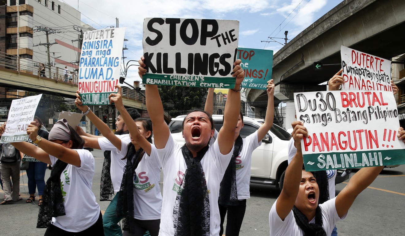 Protesters speak out against the Duterte administration’s extrajudicial killings. Photo: AP Photo