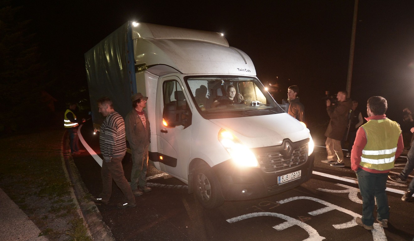 Breeders stop to check a van in Sarrance on Wednesday. Photo: AFP