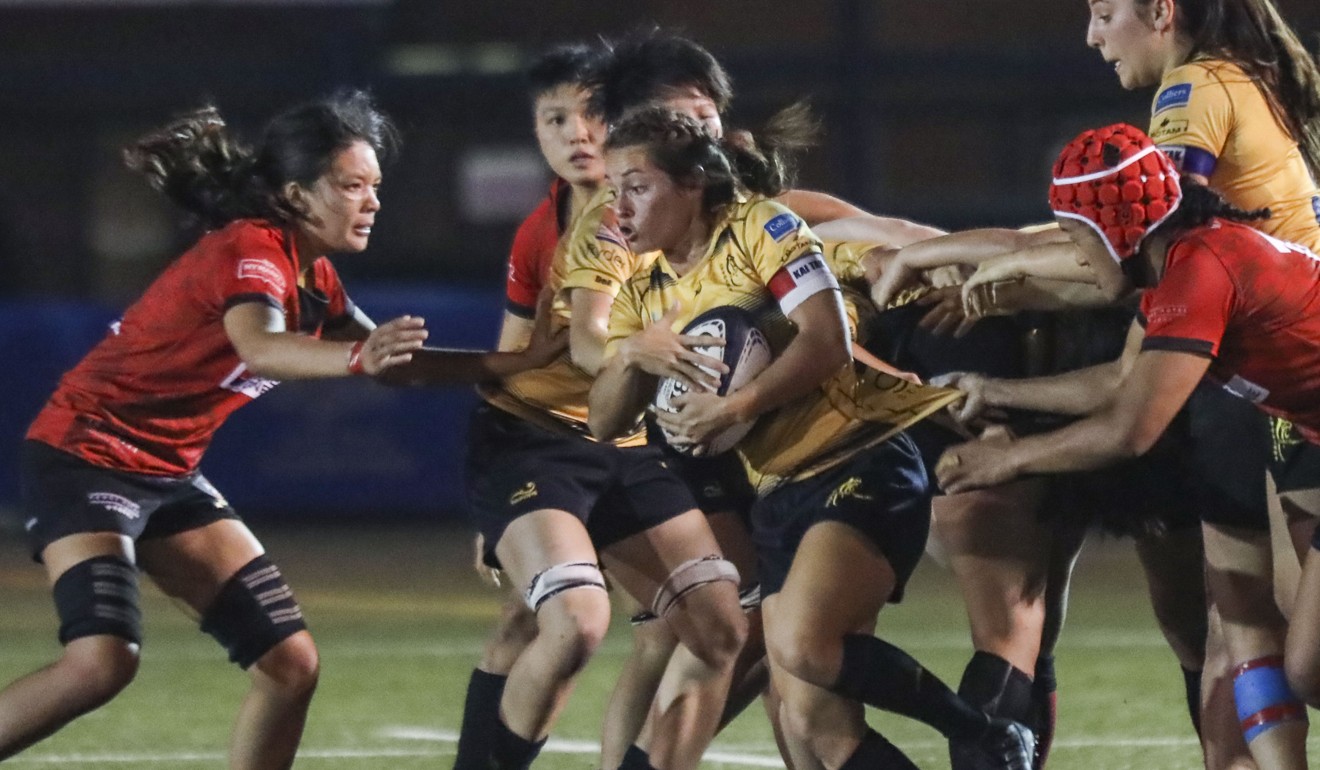 Lindsay Varty (centre) of USRC Tigers plays during the Women’s Premiership match at King’s Park in Jordan. Photo: Jonathan Wong