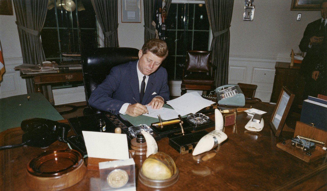 US President John F. Kennedy signs a proclamation for the interdiction of the delivery of offensive weapons to Cuba during the Cuban Missile Crisis, one of a series of sub-conflicts during the cold war between the US and the former Soviet Union. Photo: Reuters