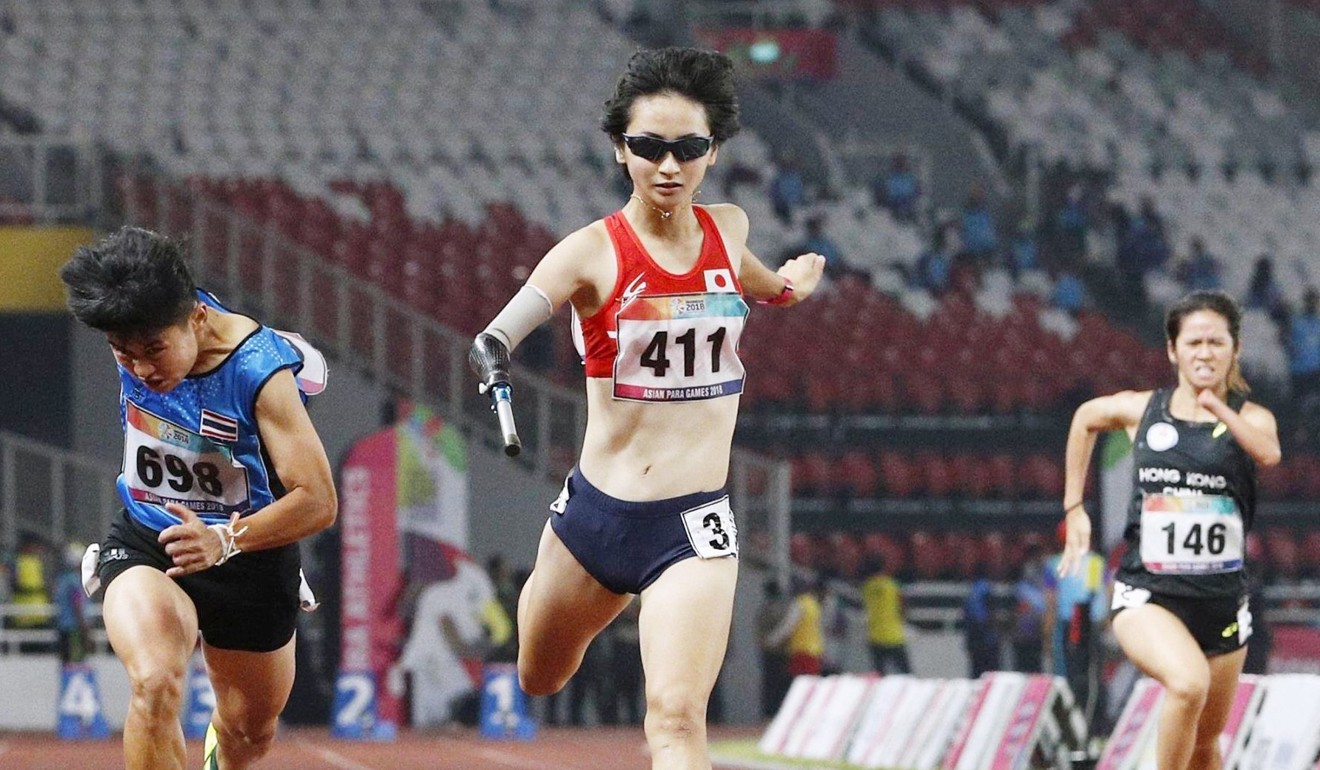 Runners compete in the women's 100-metre T47 final at the Asian Para Games in Jakarta. Photo: Kyodo